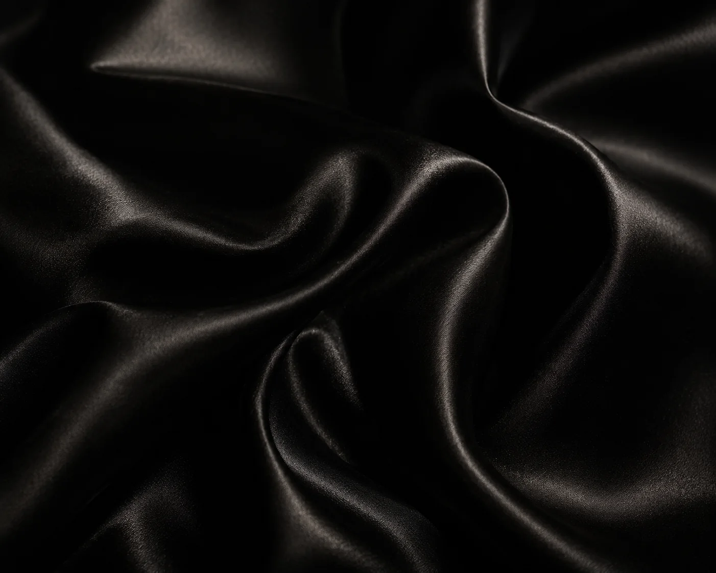 Black silk texture with subtle luxury highlights