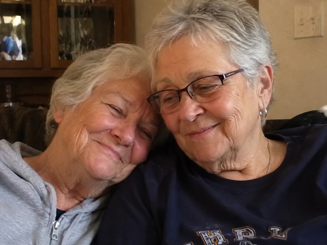 Two older women smiling together