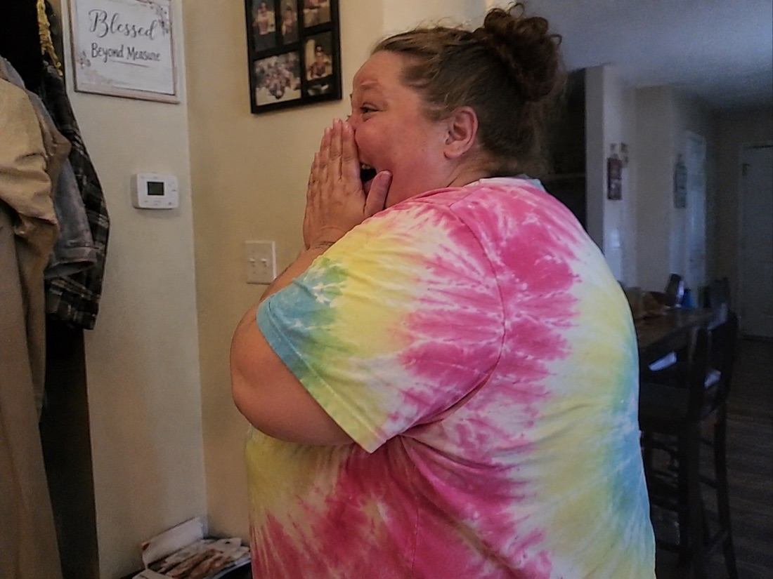 A person reacting emotionally to a custom song